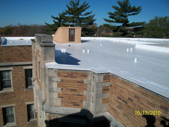 White roofing membrane used atop an old brick building