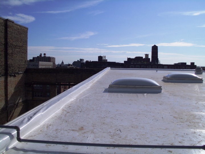 White membrane roofing installed on a commercial building's roof