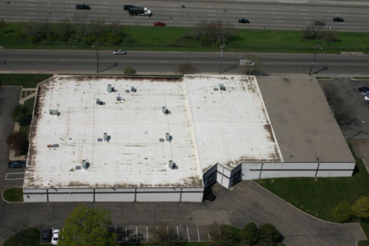 Old roofing membrane atop a commercial roof