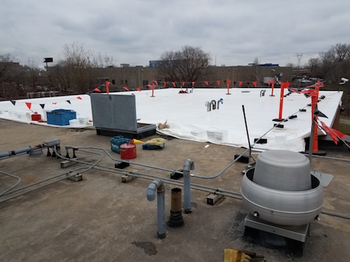 Commercial flat roof being replaced with a new membrane