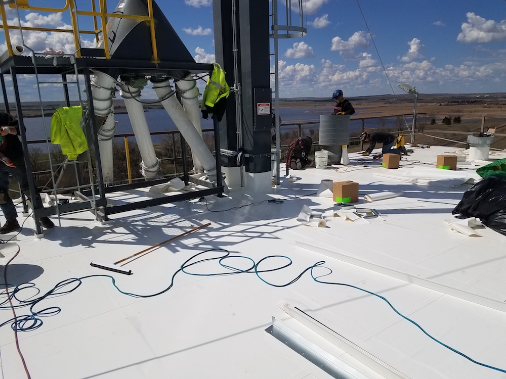 Brand new roofing being installed on a commercial roof