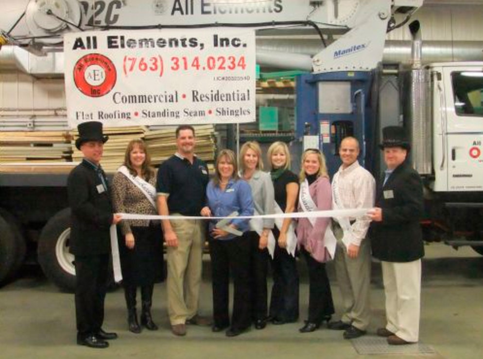 The All Elements team cutting a ribbon