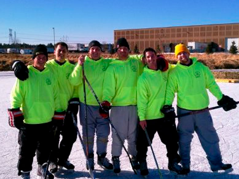 The All Elements roofing crew playing hockey