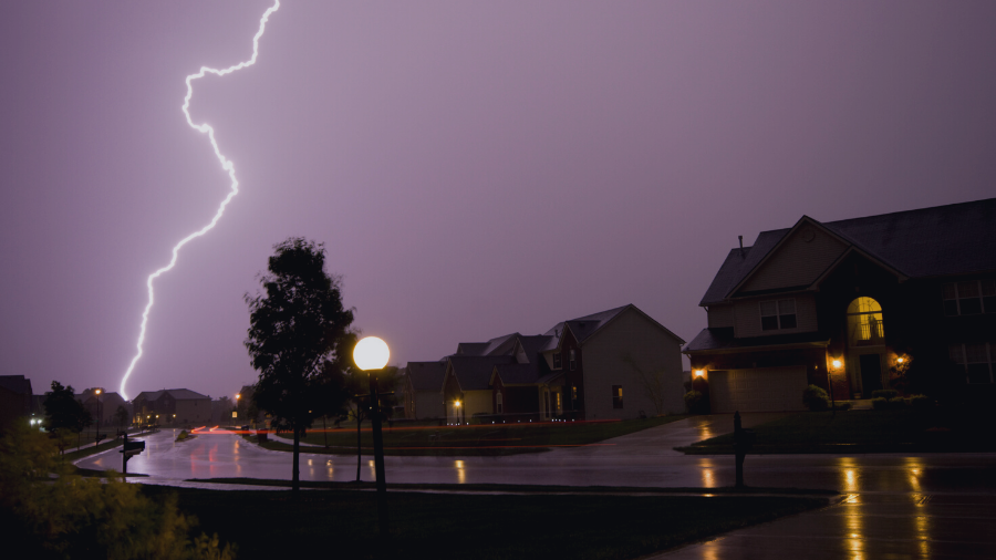 Lighting Storm about to hit house; storm damage to roof.