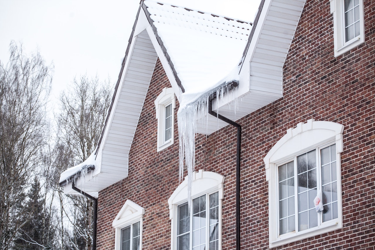 Midwest home with ice dams on roof.
