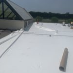 commercial roofing being unrolled