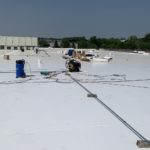 A complete rolled commercial roofing installation