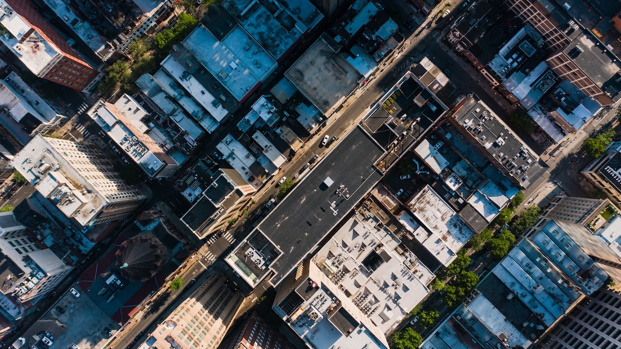 Bird's eye view of commercial roofs in downtown city area.