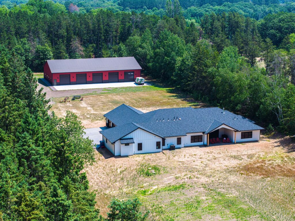 Aerial view of a newly built home and shop