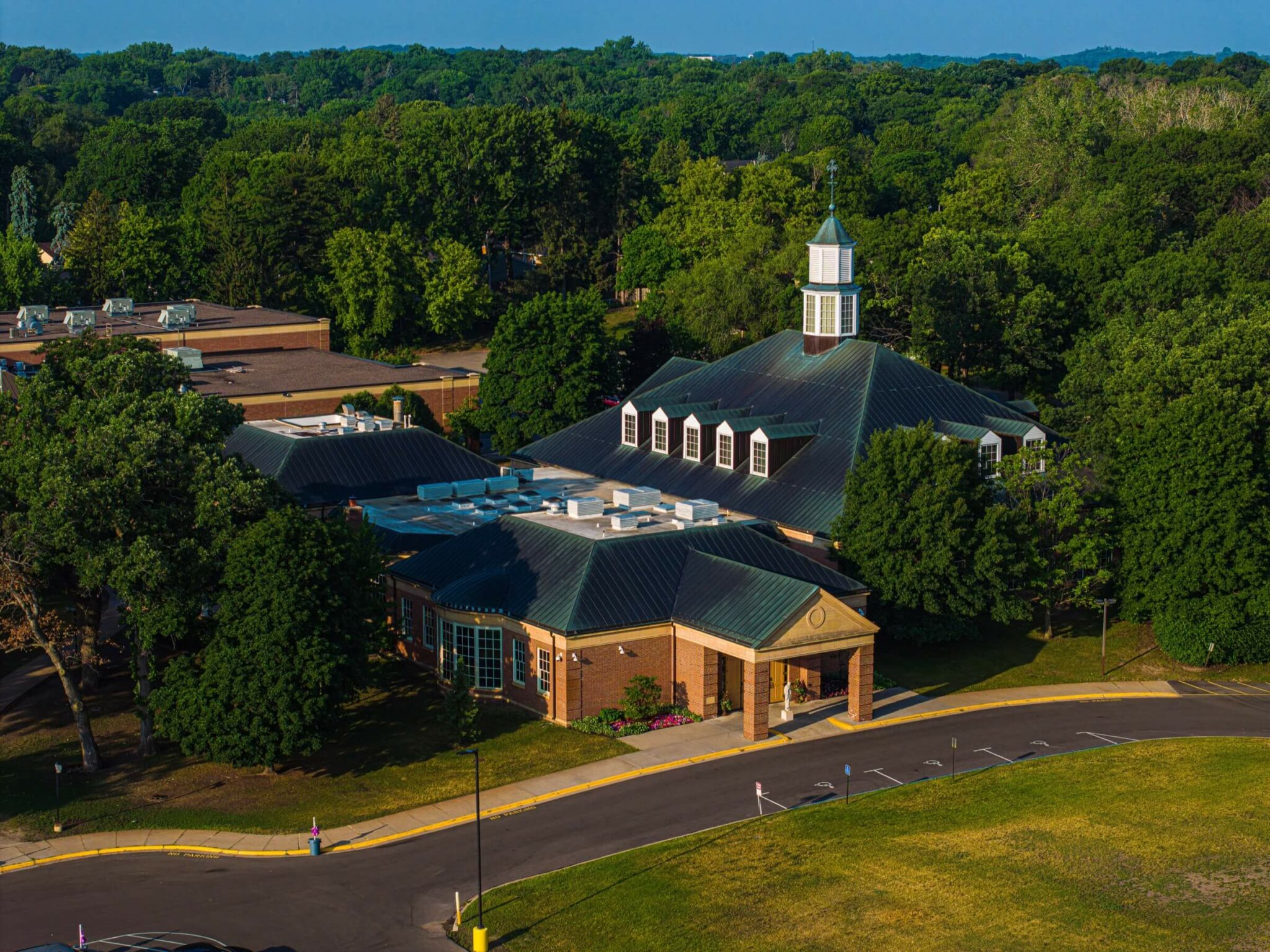 View of a church's roof with fading metal roofing