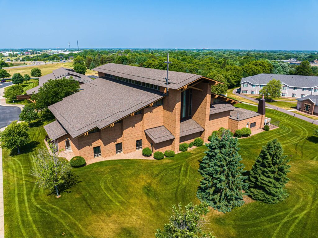 The St. Henry Catholic Church in Monticello with a freshly cut lawn